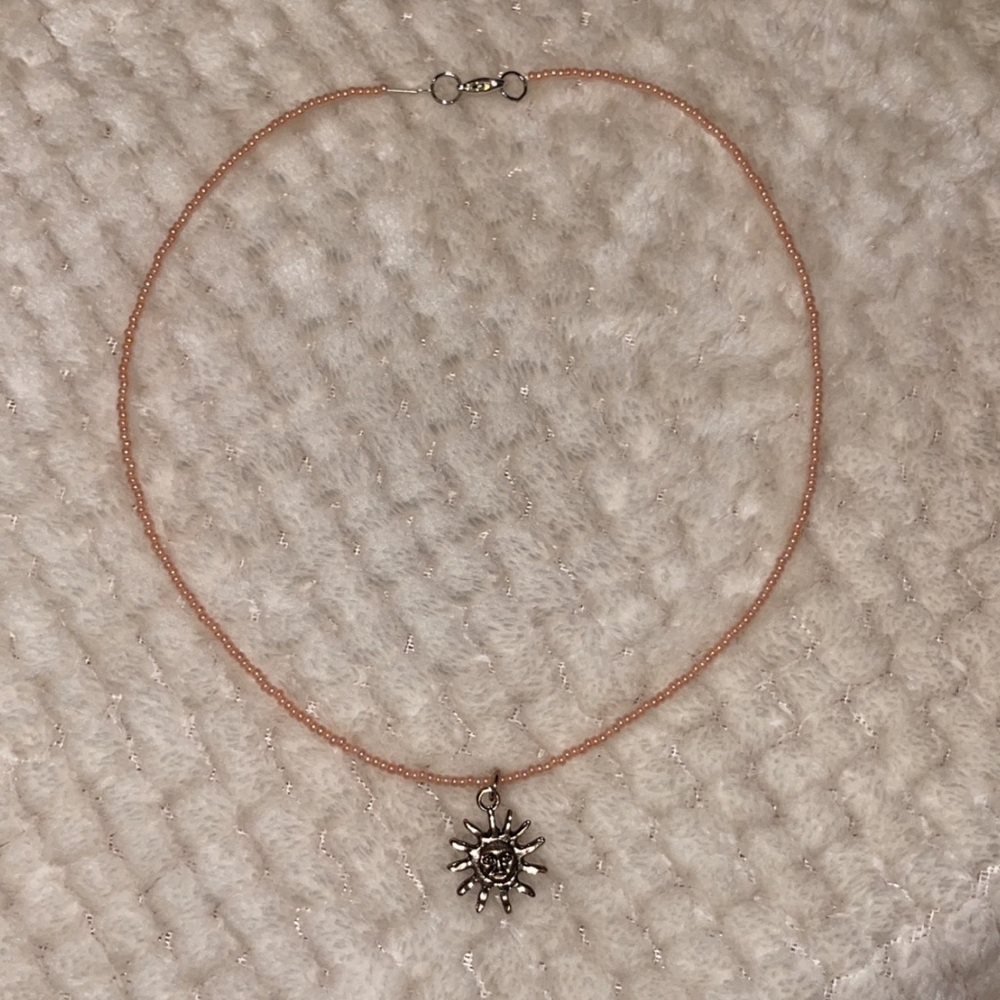 Peach hand- made beaded necklace with sun charm